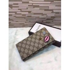 Gucci continental wallet with embroidered face 431394