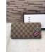 Gucci continental wallet with embroidered face 431394