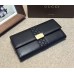 Gucci engraved gucci metal plate continental wallet 233028 black leather