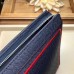 Louis Vuitton Pochette Voyage MM Bag Taiga Leather Outline Navy Blue/Red M63394